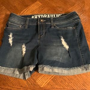 longer jean shorts with subtle rips and bedazzled pockets